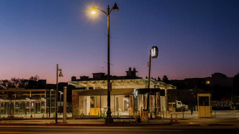 A Metro station construction site at sunset.