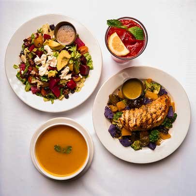 Two dishes, a soup, and a drink.