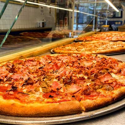 Three pizzas in the selection window at Lamonica's NY Pizza - Westwood.