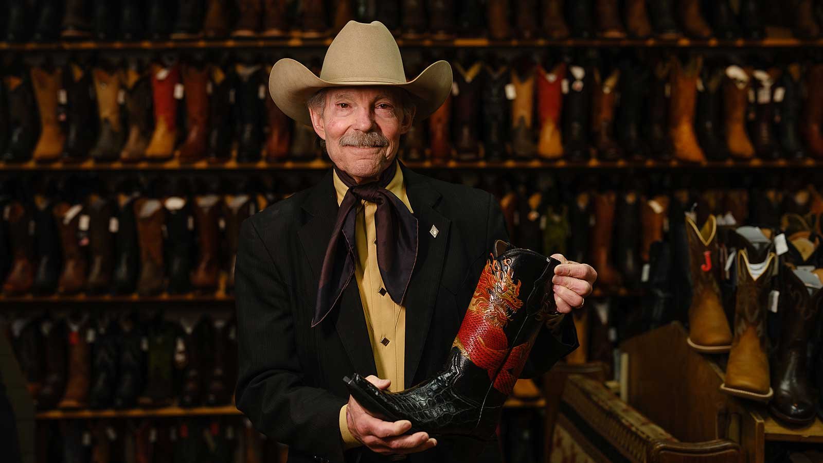 Owner of Country General Store wearing a cowboy hat, denim, amongst other western treasures.