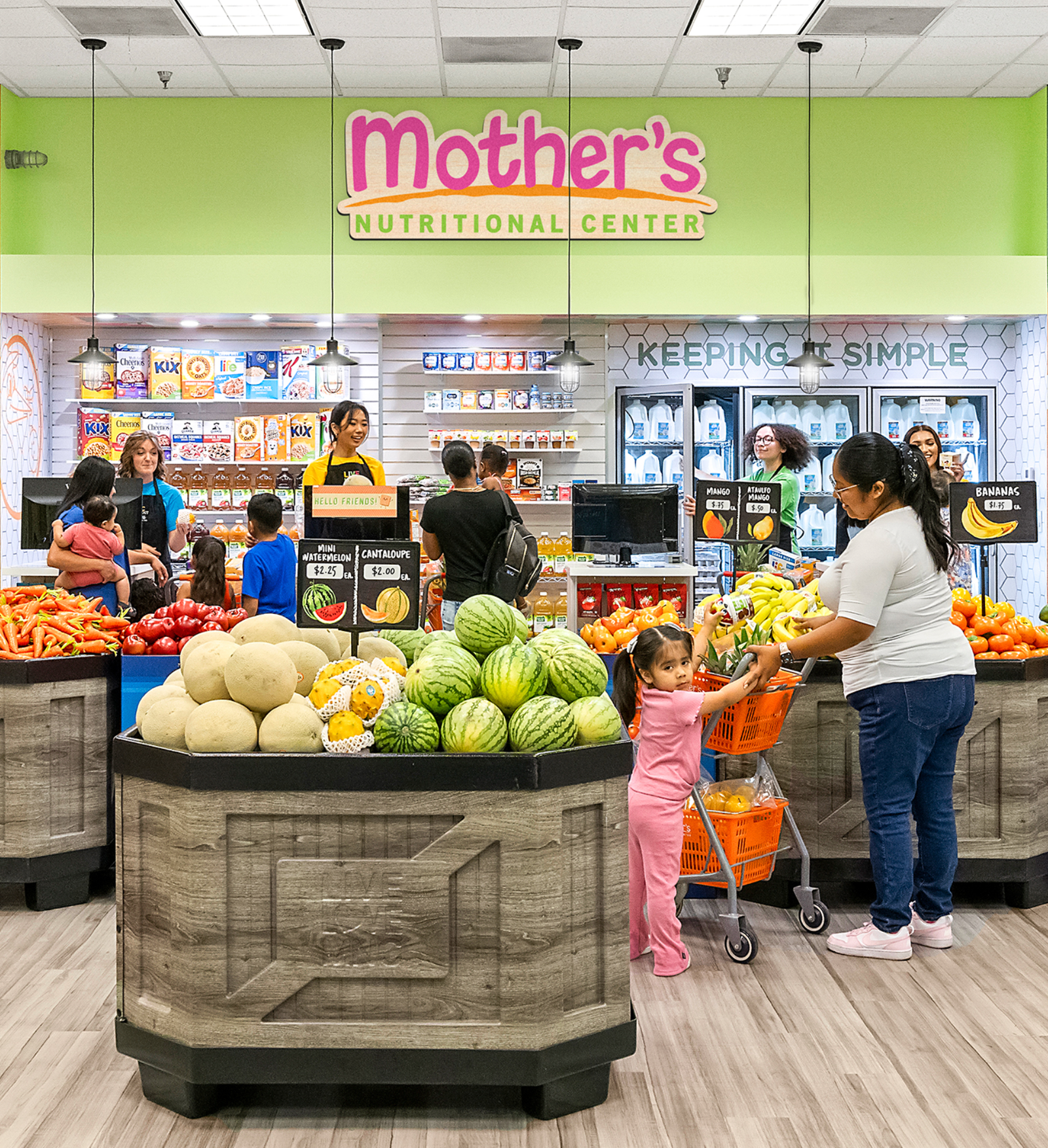 Mother's Nutritional Center – shoppers browsing the fresh produce display inside the grocery store beneath the Mother's sign.